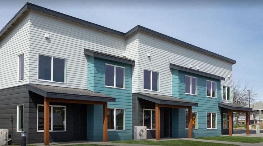 a blue and white building with a blue sky